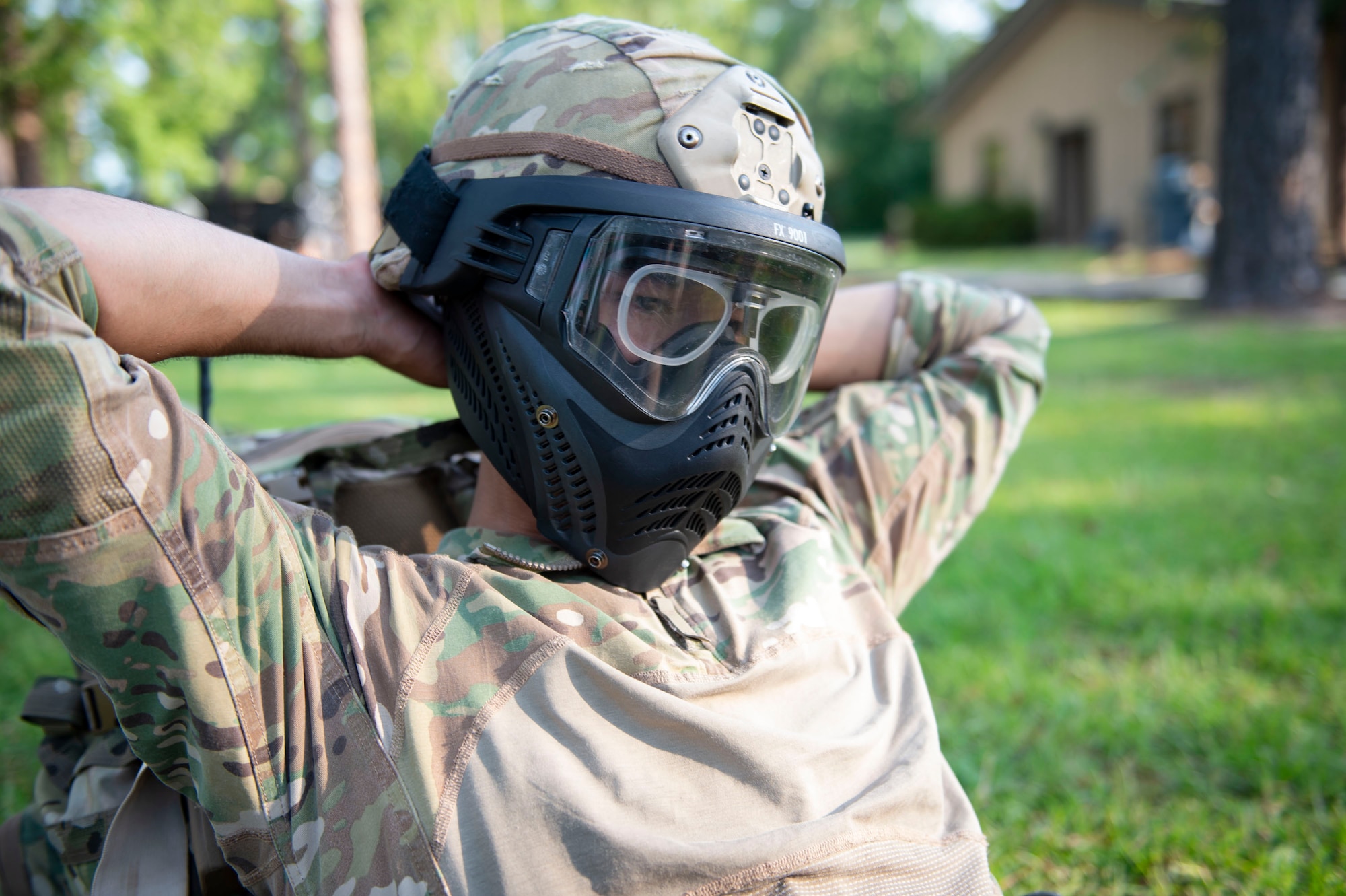 Airman 1st Class Andres Gonzales, 824th Base Defense Squadron fire team member, puts on a simunition mask during the Tactical Leaders Course, Aug. 10, 2019, at Moody Air Force Base, Ga. The 7-day course revolved around squad leaders developing their skills to effectively communicate, team build and mission plan. These skills were assessed during a 36-hour simulated operation where squad leaders lead Airmen through tactical situations. (U.S. Air Force photo by Airman Azaria E. Foster)