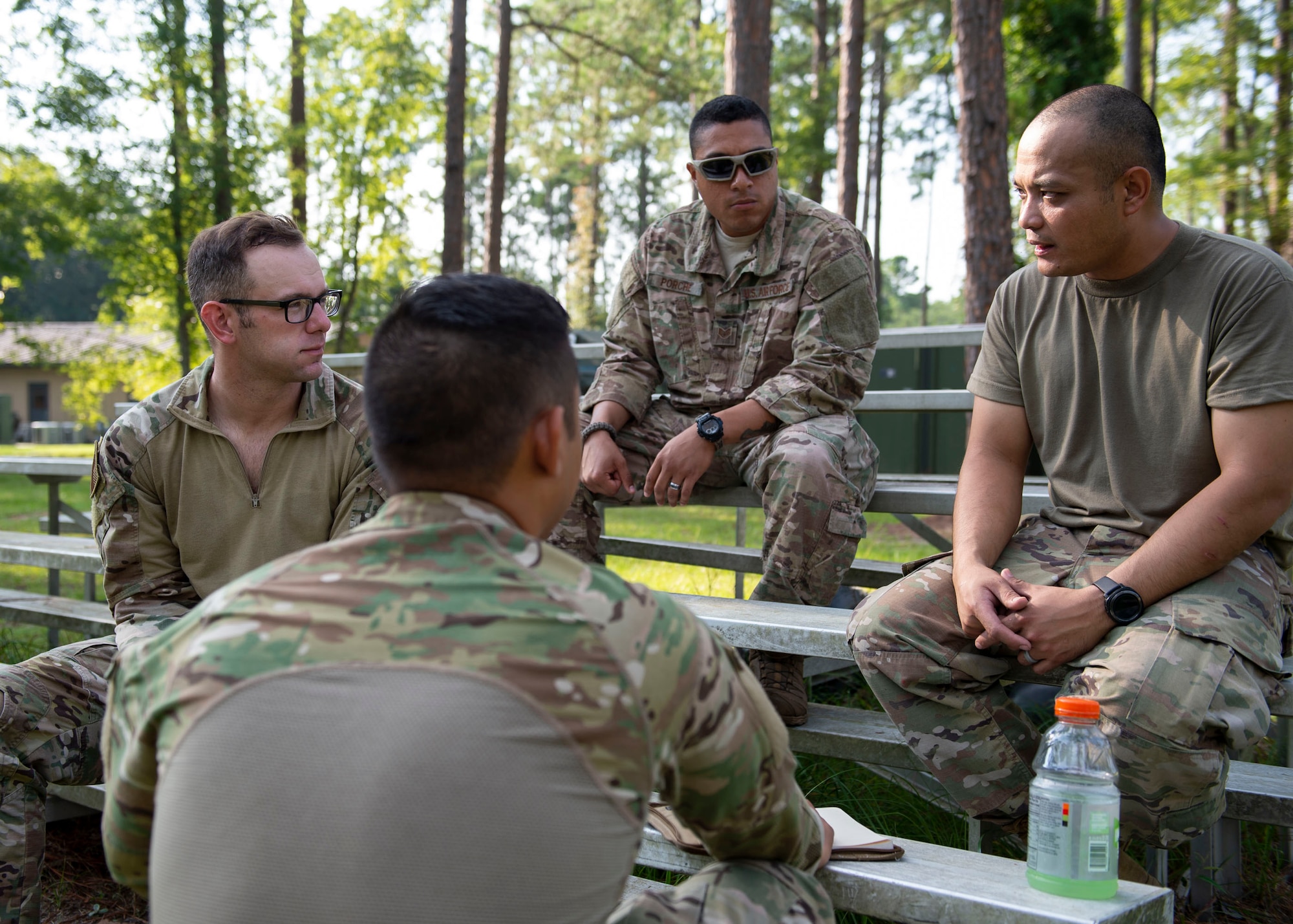 Participants of the Tactical Leaders Course discuss strategy during the course, Aug. 10, 2019, at Moody Air Force Base, Ga. The 7-day course revolved around squad leaders developing their skills to effectively communicate, team build and mission plan. These skills were assessed during a 36-hour simulated operation where squad leaders lead Airmen through tactical situations. (U.S. Air Force photo by Airman Azaria E. Foster)