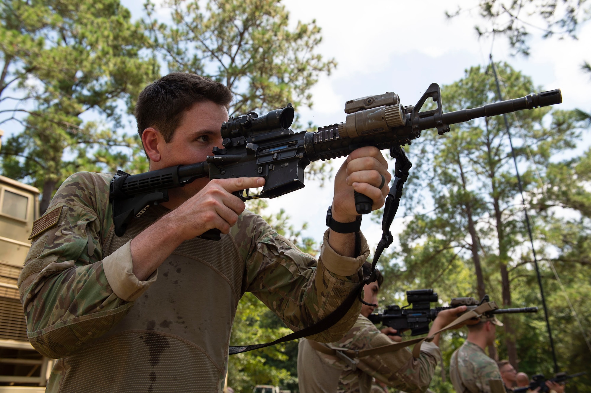Senior Airman Tristan Wiese, 824th Base Defense Squadron fire team member, aims down his sight during the Tactical Leaders Course, Aug. 10, 2019, at Moody Air Force Base, Ga. The 7-day course revolved around squad leaders developing their skills to effectively communicate, team build and mission plan. These skills were assessed during a 36-hour simulated operation where squad leaders lead Airmen through tactical situations. (U.S. Air Force photo by Airman Azaria E. Foster)