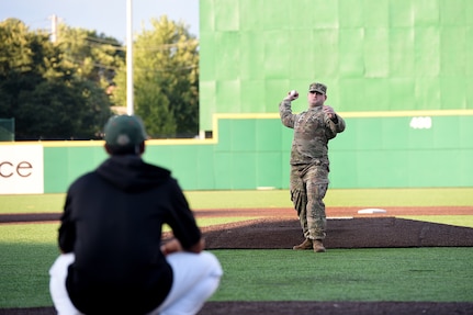 Army Reserve Staff Sgt. Clifford Arrington, Information Systems noncommissioned officer assigned to the 85th U.S. Army Reserve Support Command, throws in a ceremonial first pitch before a Joliet Slammers home game, August 13, 2019 in Joliet, Illinois.