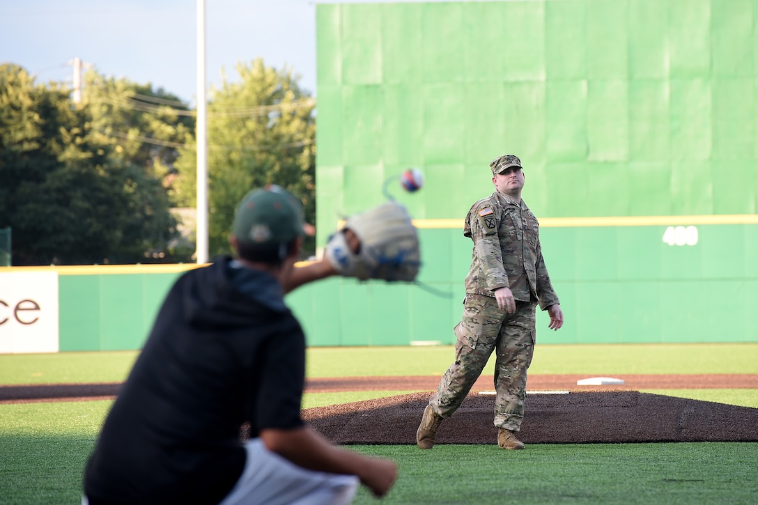 Army Reserve Staff Sgt. Clifford Arrington, Information Systems noncommissioned officer assigned to the 85th U.S. Army Reserve Support Command, throws in a ceremonial first pitch before a Joliet Slammers home game, August 13, 2019 in Joliet, Illinois.