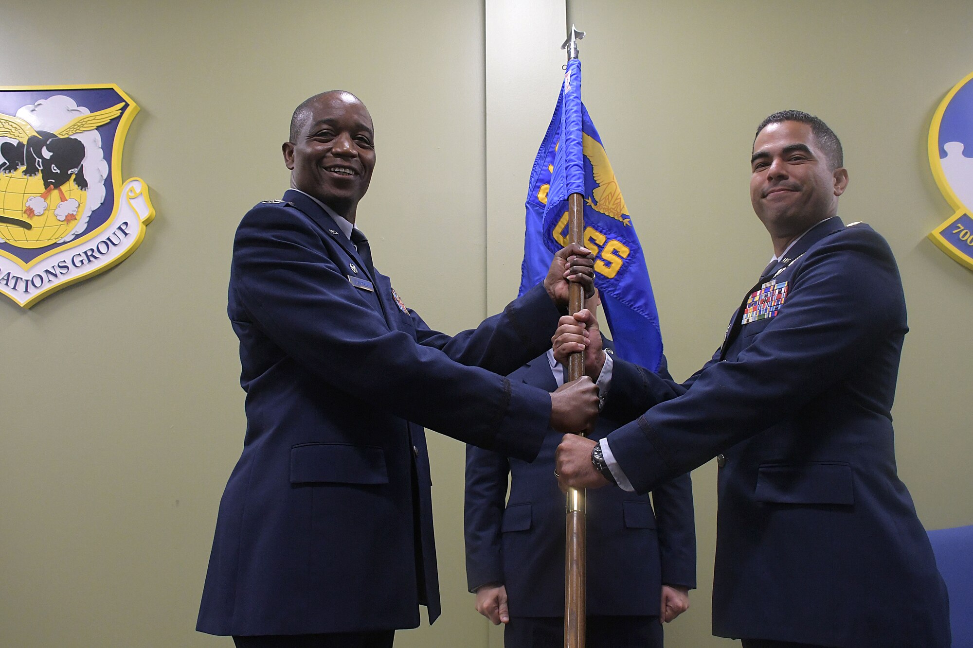 Maj. Oscar Rondon, right, receives the guidon from Col. Patrick Campbell, 94th Operations Group commander, Aug. 8, 2019.