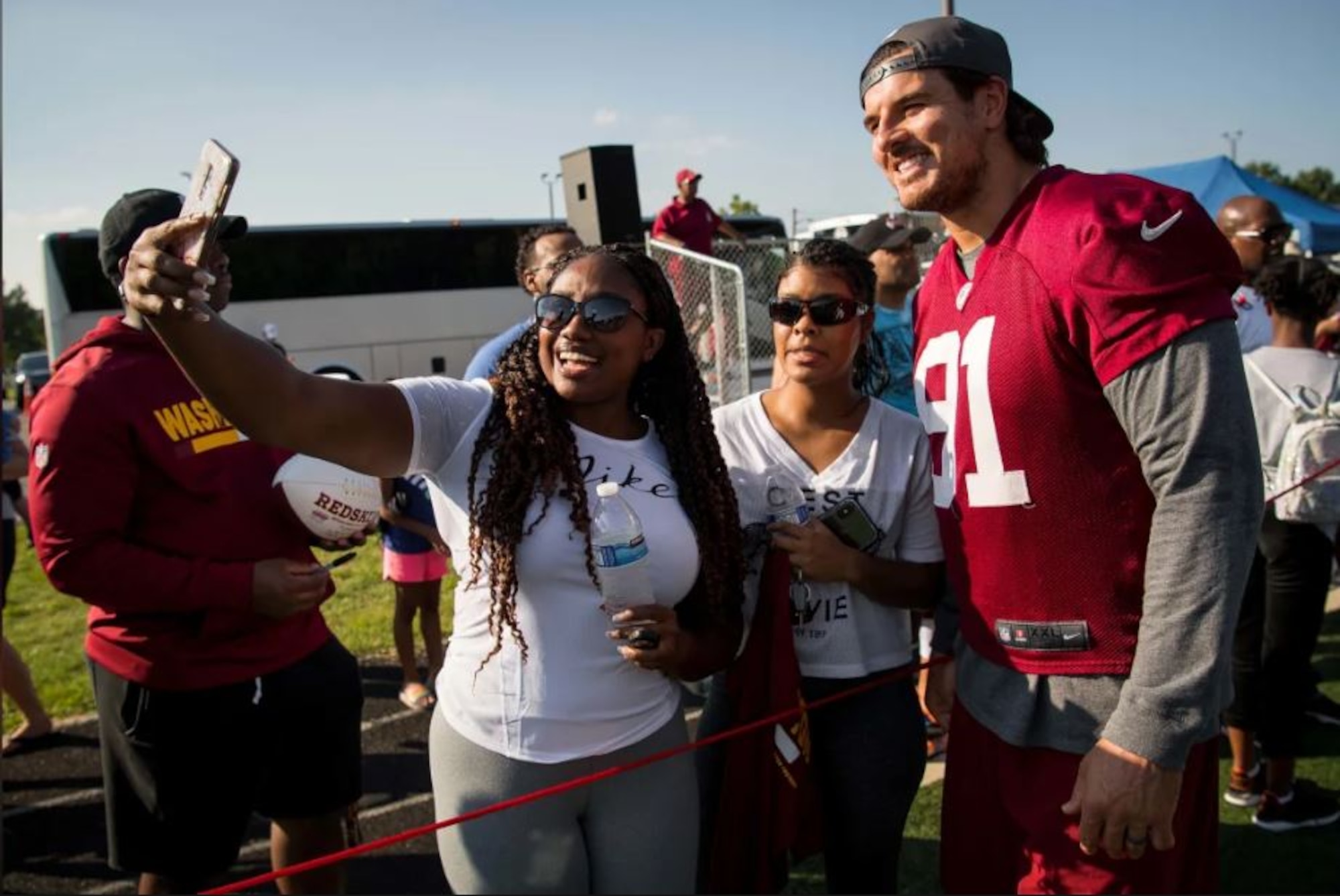 Fans take a selfie with Washington Redskins outside linebacker Ryan Kerrigan during a visit to Joint Base Andrews Aug. 14. The team held a special walkthrough practice here as part of ongoing Redskins Salute efforts presented by USAA. (Courtesy photo/Washington Redskins)
