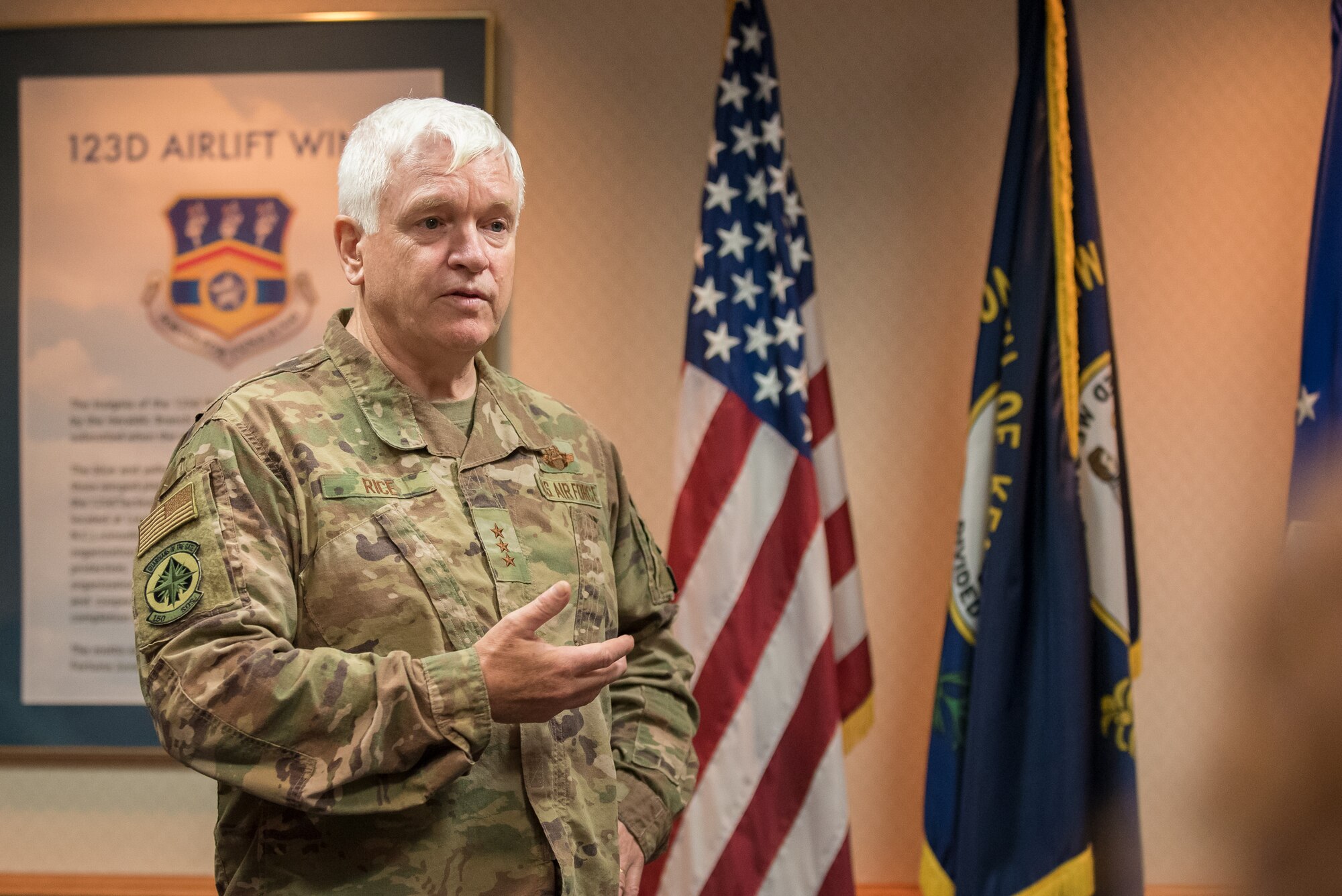 Lt. Gen. L. Scott Rice, director of the Air National Guard, discusses the career accomplishments of Brig. Gen. Warren Hurst, Kentucky’s assistant adjutant general for Air, during a ceremony at the Kentucky Air National Guard base in Louisville, Ky., Aug. 10, 2019. Rice presented Hurst with the Distinguished Service Medal, which recognizes exceptionally meritorious service in duties of great responsibility. (U.S. Air National Guard photo by Dale Greer)