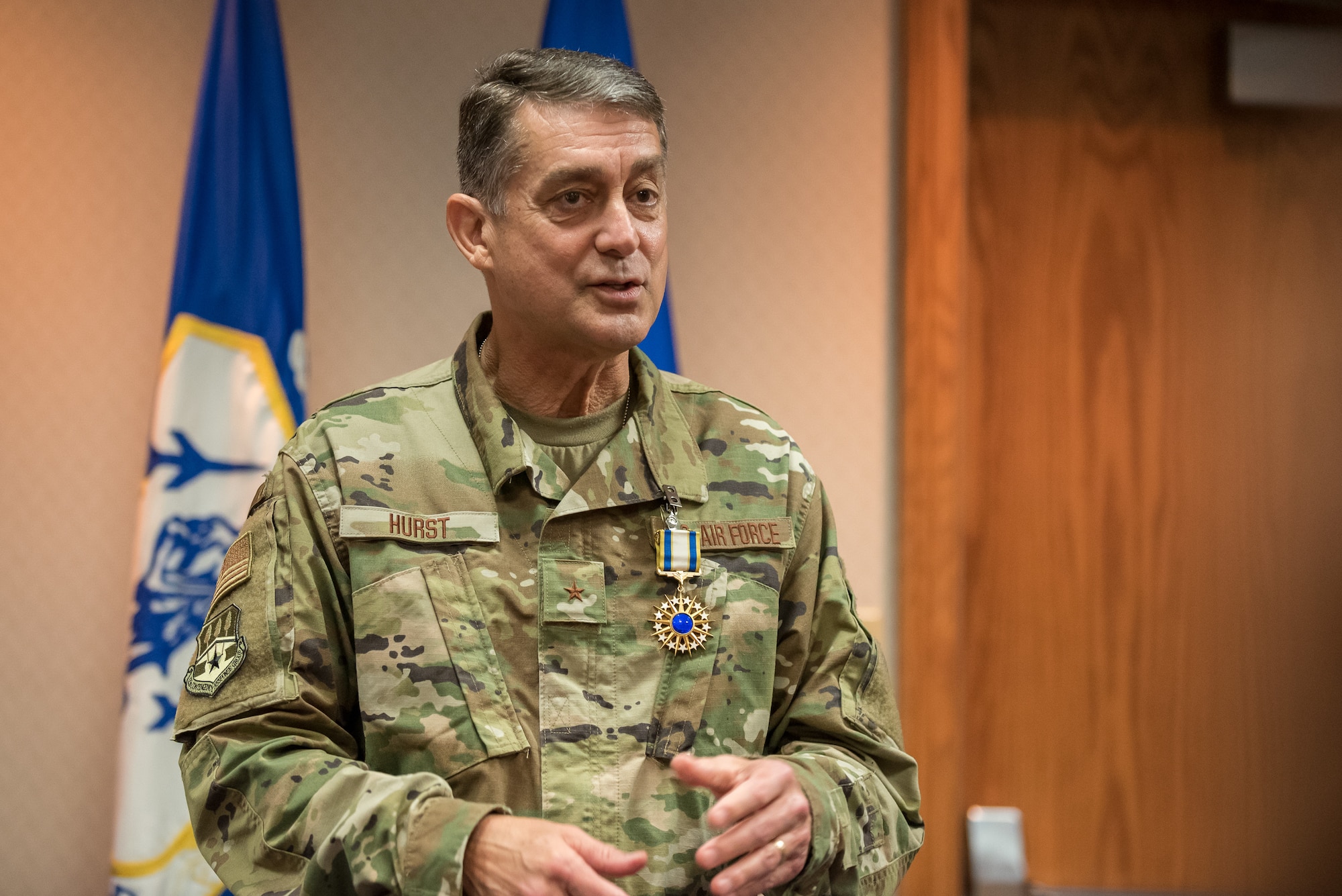 Brig. Gen. Warren Hurst, Kentucky’s assistant adjutant general for Air, speaks to members of the audience during a ceremony at the Kentucky Air National Guard base in Louisville, Ky., Aug. 10, 2019. Lt. Gen. L. Scott Rice, director of the Air National Guard, presented Hurst with the Distinguished Service Medal during the ceremony, recognizing Hurst's exceptionally meritorious service in duties of great responsibility. (U.S. Air National Guard photo by Dale Greer)