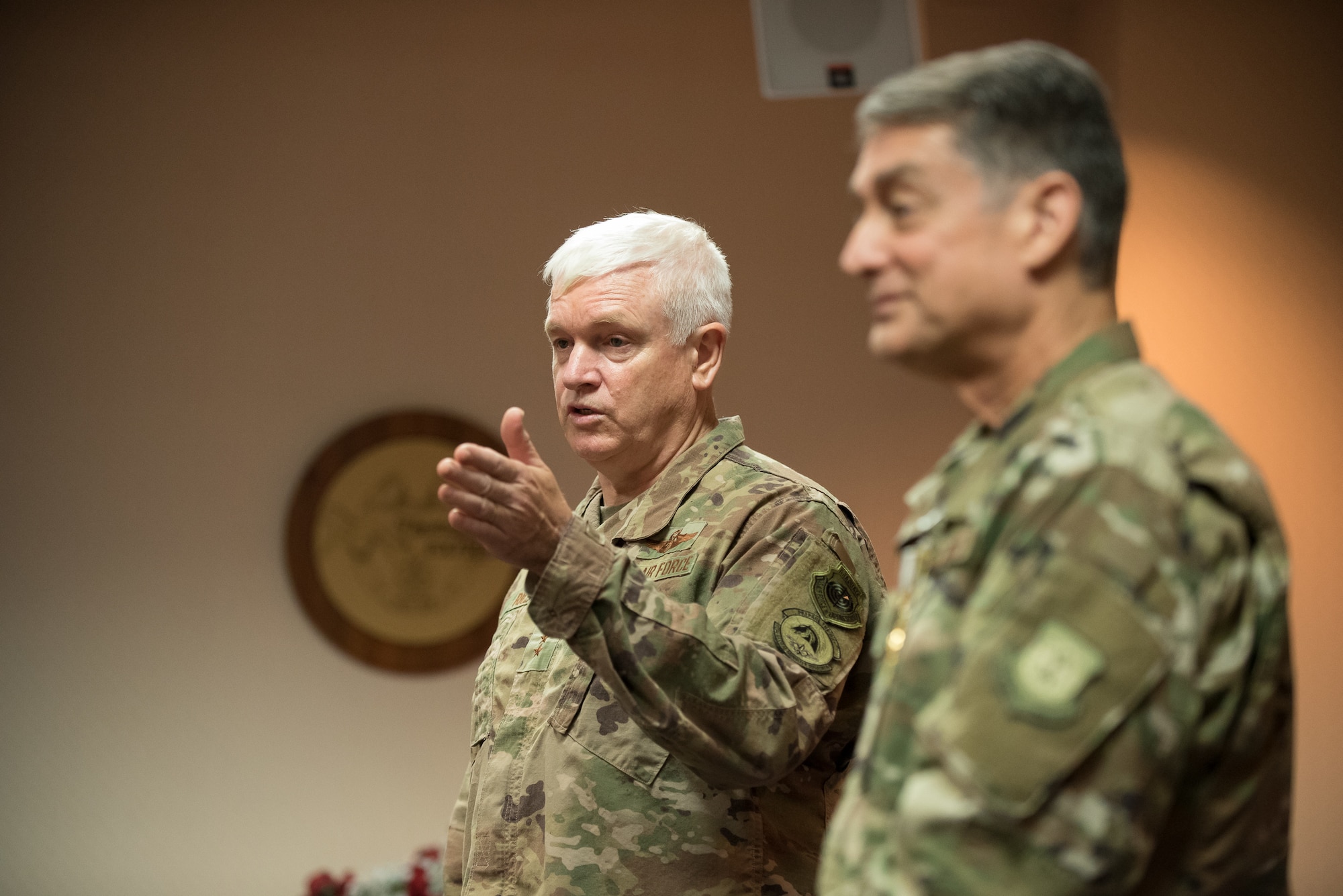 Lt. Gen. L. Scott Rice (left), director of the Air National Guard, discusses the career accomplishments of Brig. Gen. Warren Hurst, Kentucky’s assistant adjutant general for Air, during a ceremony at the Kentucky Air National Guard base in Louisville, Ky., Aug. 10, 2019. Rice presented Hurst with the Distinguished Service Medal, which recognizes exceptionally meritorious service in duties of great responsibility. (U.S. Air National Guard photo by Dale Greer)