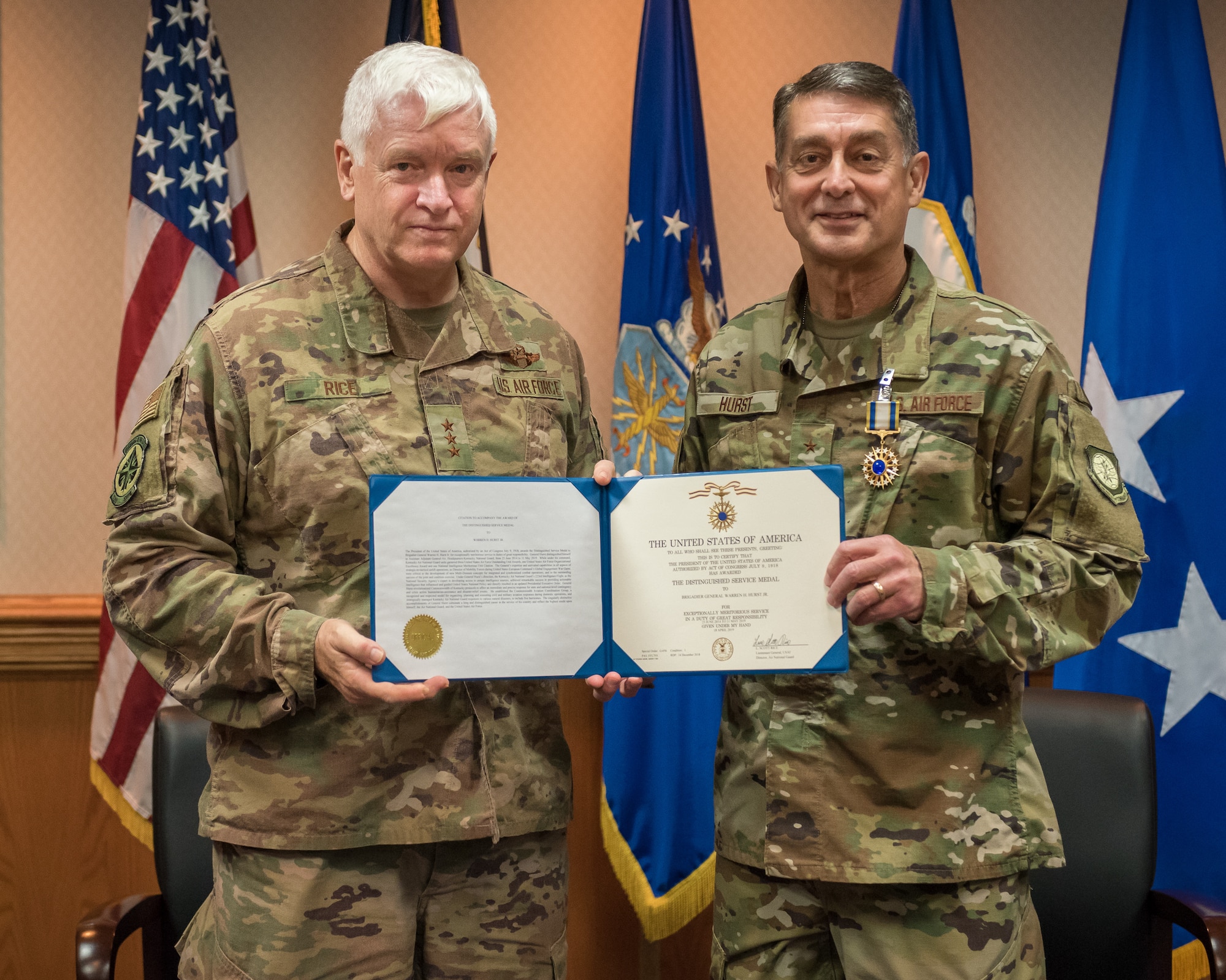 Lt. Gen. L. Scott Rice (left), director of the Air National Guard, presents the Distinguished Service Medal to Brig. Gen. Warren Hurst, Kentucky’s assistant adjutant general for Air, during a ceremony at the Kentucky Air National Guard base in Louisville, Ky., Aug. 10, 2019. Hurst earned the honor for exceptionally meritorious service in duties of great responsibility. (U.S. Air National Guard photo by Dale Greer)