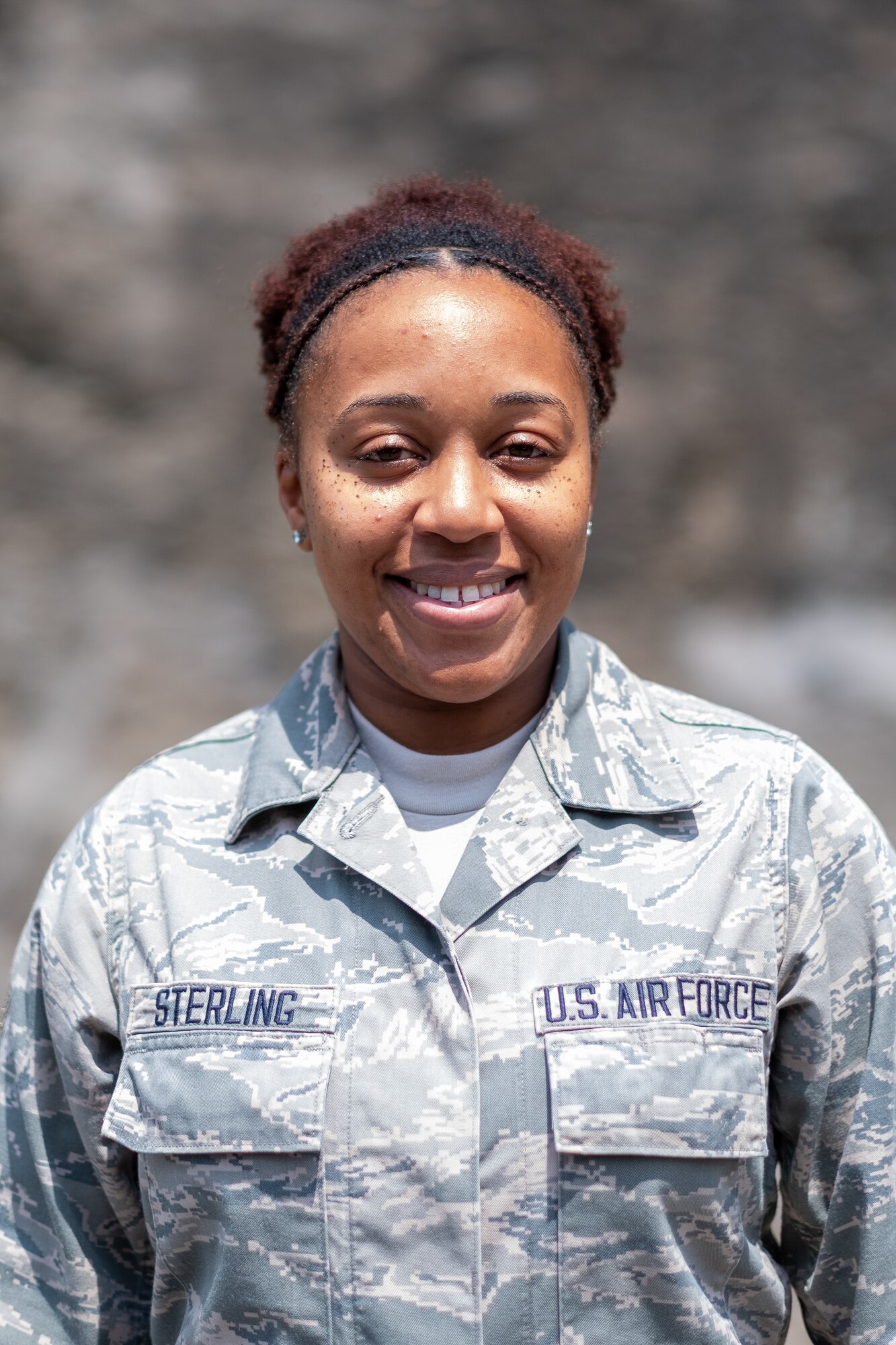 U.S. Air Force Staff Sgt. Nefertede Sterling, medical logistics with the 514th Aeromedical Squadron, 514th Air Mobility Wing out of Joint Base McGuire-Dix-Lakehurst, New Jersey, poses for a portrait by the EXCEL Center clinic in Clay County, Kentucky, August 10, 2019. Sterling was part of the medical logistics team which joined the main body of more than 150 joint-service military members at the tail-end of the mission. Over the course of this medically focused mission, 1,805 civilian patients were treated. Overall, 12,762 procedures were administered to the patients on a first-come, first-served basis and a total value of $1,175,137 of services were provided at no cost to the patients. This mission also resulted in the accumulation of 30,638 military training hours.