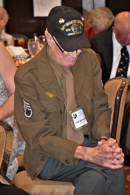 Jack Robinson, a World War II veteran of the 94th Infantry Division, pauses for a moment of prayer and reflection at the 70th anniversary of the 94th Infantry Division Historical Society's annual reunion in Columbus, Georgia, June 14-15, 2019. The 94th Training Division-Force Sustainment coordinated with the 94th IDHS to hold the reunion where 94th veterans, families and friends came together to honor and remember their rich history and legacy.