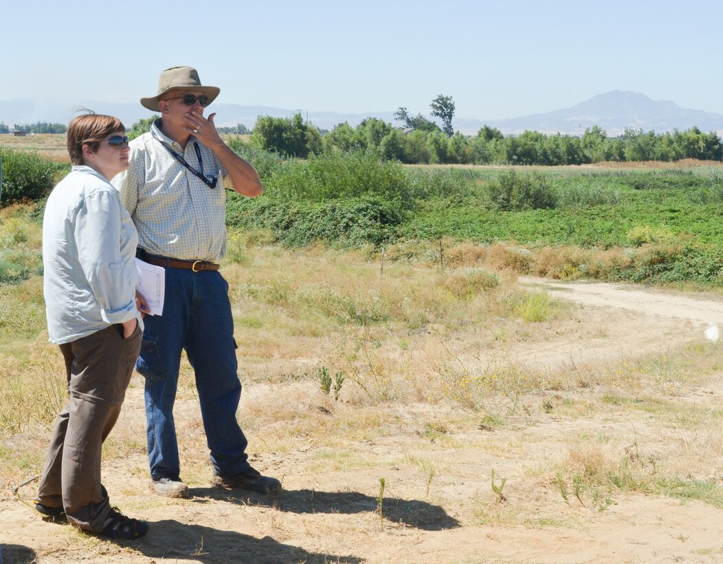 U.S. Army Corps of Engineers Sacramento District environmental planner Brooke Schlenker (left) and civil engineer Larry Nemetz survey the Horseshoe Bend levee.
