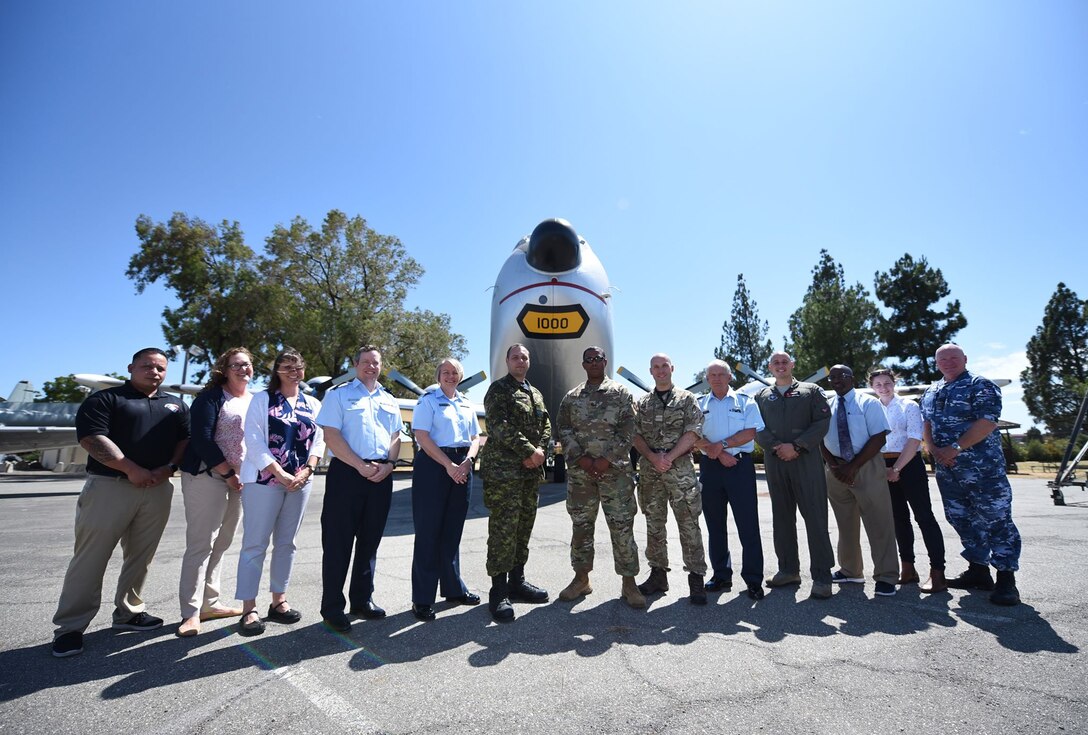 Five Eyes Air Force Interoperability Council representatives stand outside the Heritage Center at Travis Air Force Base, California, Aug. 9, 2019. The group, which comprises armed forces members from Australia, Canada, New Zealand, the United Kingdom and the United States, meets annually to discuss, learn and test existing and new interoperability strategies. (U.S. Air Force photo by Senior Airman Christian Conrad)