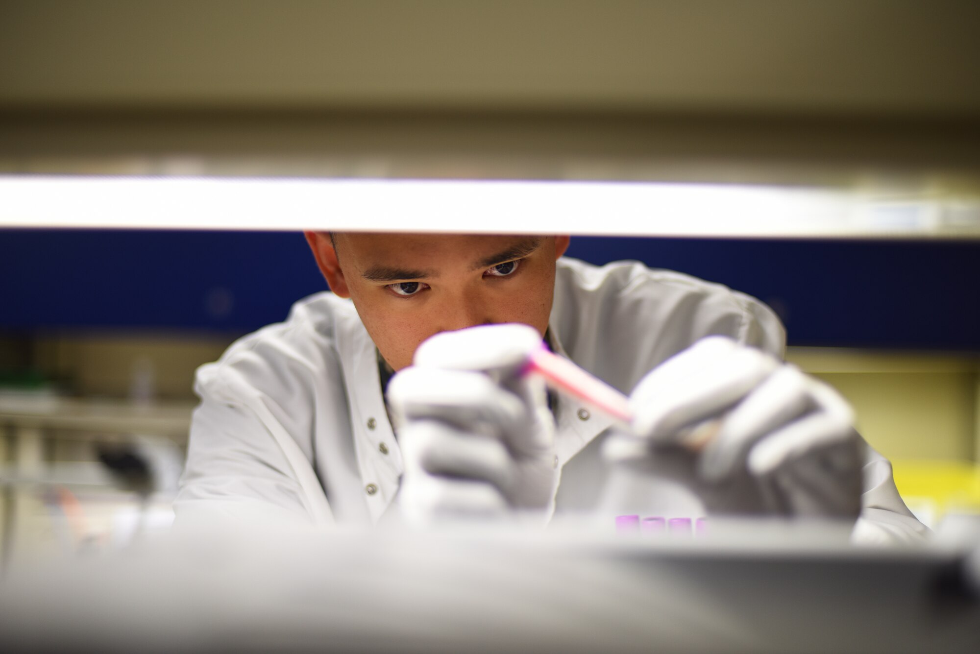 U.S. Air Force Senior Airman Philip Fisketjon, 341st Medical Group medical laboratory technician, examines a complete blood count at the laboratory on Malmstrom Air Force Base, Montana, Aug. 13, 2019. Medical laboratory technicians play an integral role in providing patients with a proper diagnosis and treatment by conducting essential tests on body substances. (U.S. Air Force photo by Airman 1st Class Jacob M. Thompson)