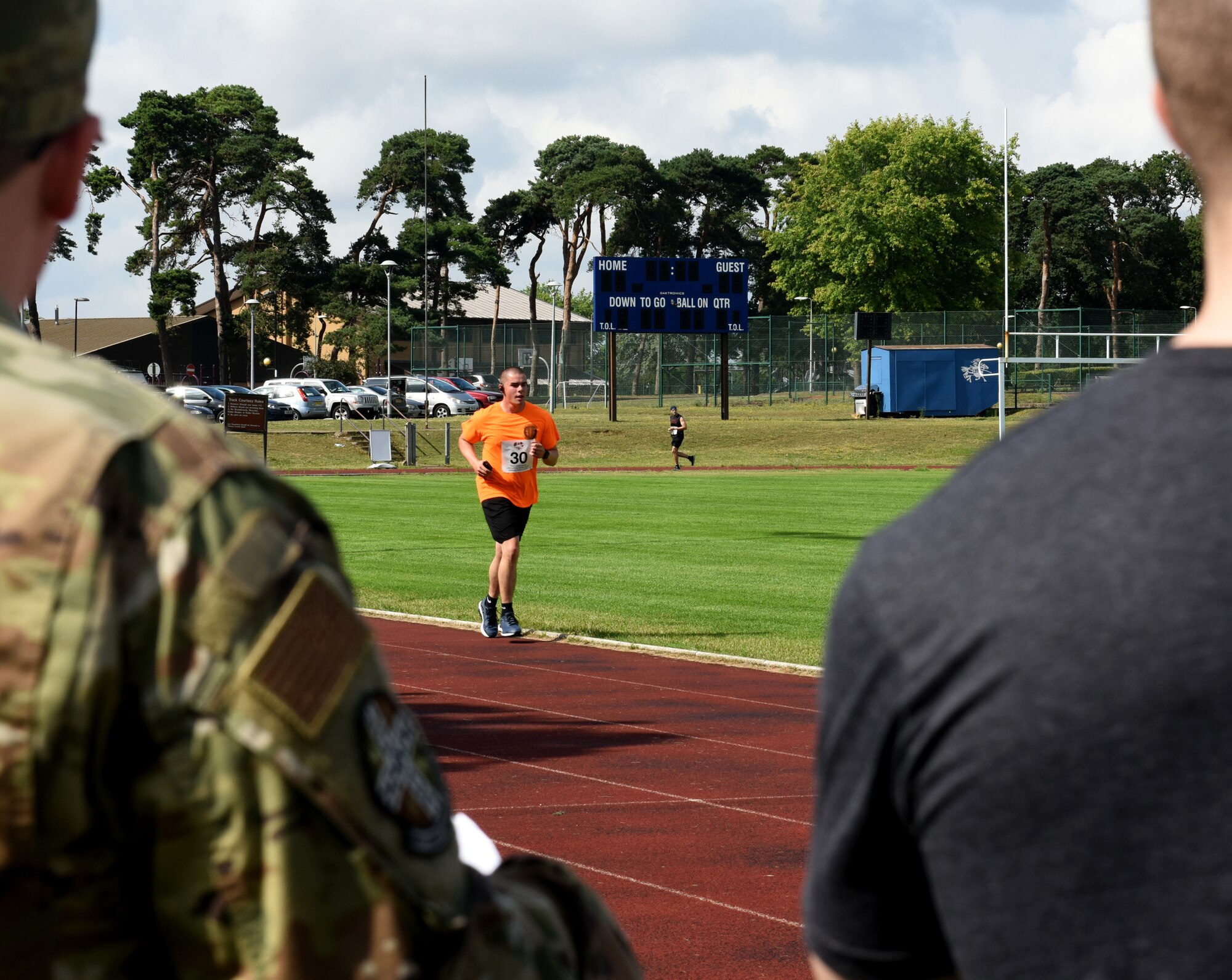 A Liberty Wing Airman participates in the Operation Warm Heart run-a-thon at Royal Air Force Lakenheath, England, Aug. 2, 2019. Operation Warm Heart is a non-profit organization through the First Sergeant Council that provides emergency funds and relief for Airmen. (Courtesy photo by Carissa Chae)