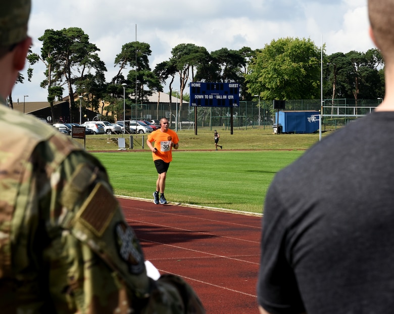 A Liberty Wing Airman participates in the Operation Warm Heart run-a-thon at Royal Air Force Lakenheath, England, Aug. 2, 2019. Operation Warm Heart is a non-profit organization through the First Sergeant Council that provides emergency funds and relief for Airmen. (Courtesy photo by Carissa Chae)