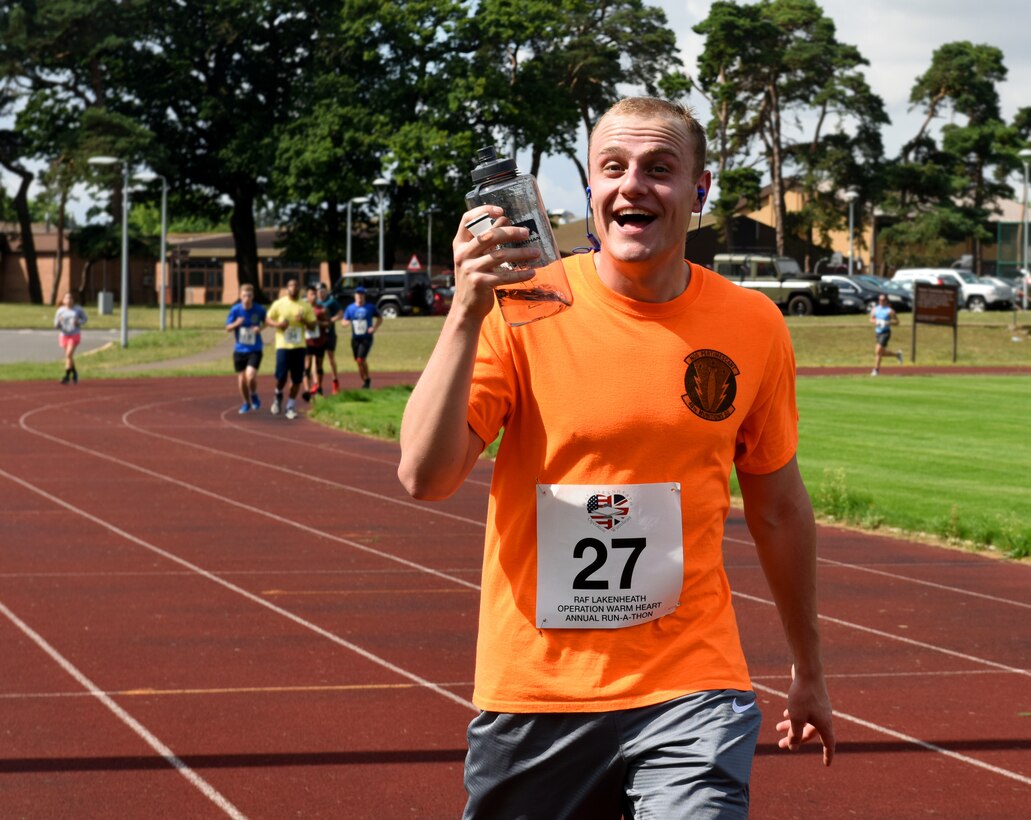 A Liberty Wing Airman participates in the Operation Warm Heart run-a-thon at Royal Air Force Lakenheath, England, Aug. 2, 2019. Operation Warm Heart is a non-profit organization through the First Sergeant Council that provides emergency funds and relief for Airmen. (Courtesy photo by Carissa Chae)