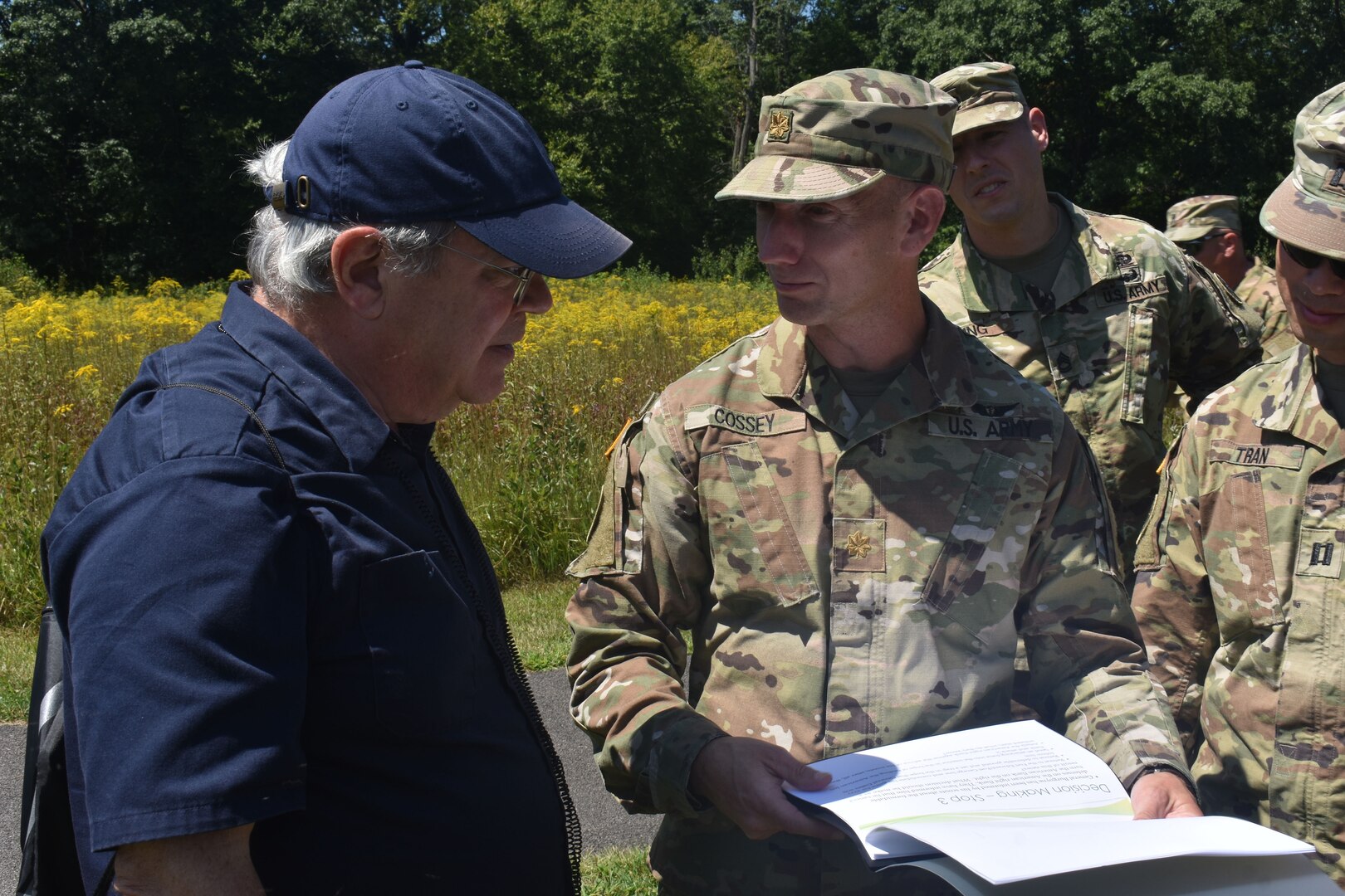 New York Army National Guard Maj. Jason Cossey speaks with James Hughto on a training exercise, at Saratoga Battlefield, Saratoga, N.Y., on Aug. 14, 2019. Cossey and other Soldiers were participating in the Commander’s Career Course, and getting a tour of Saratoga Battlefield.