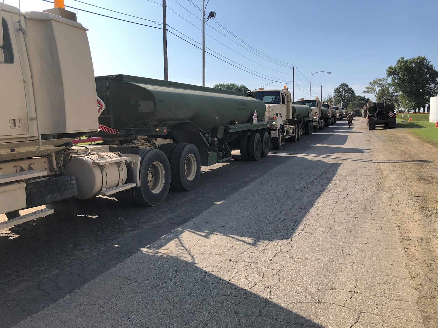 military fuel trucks line up