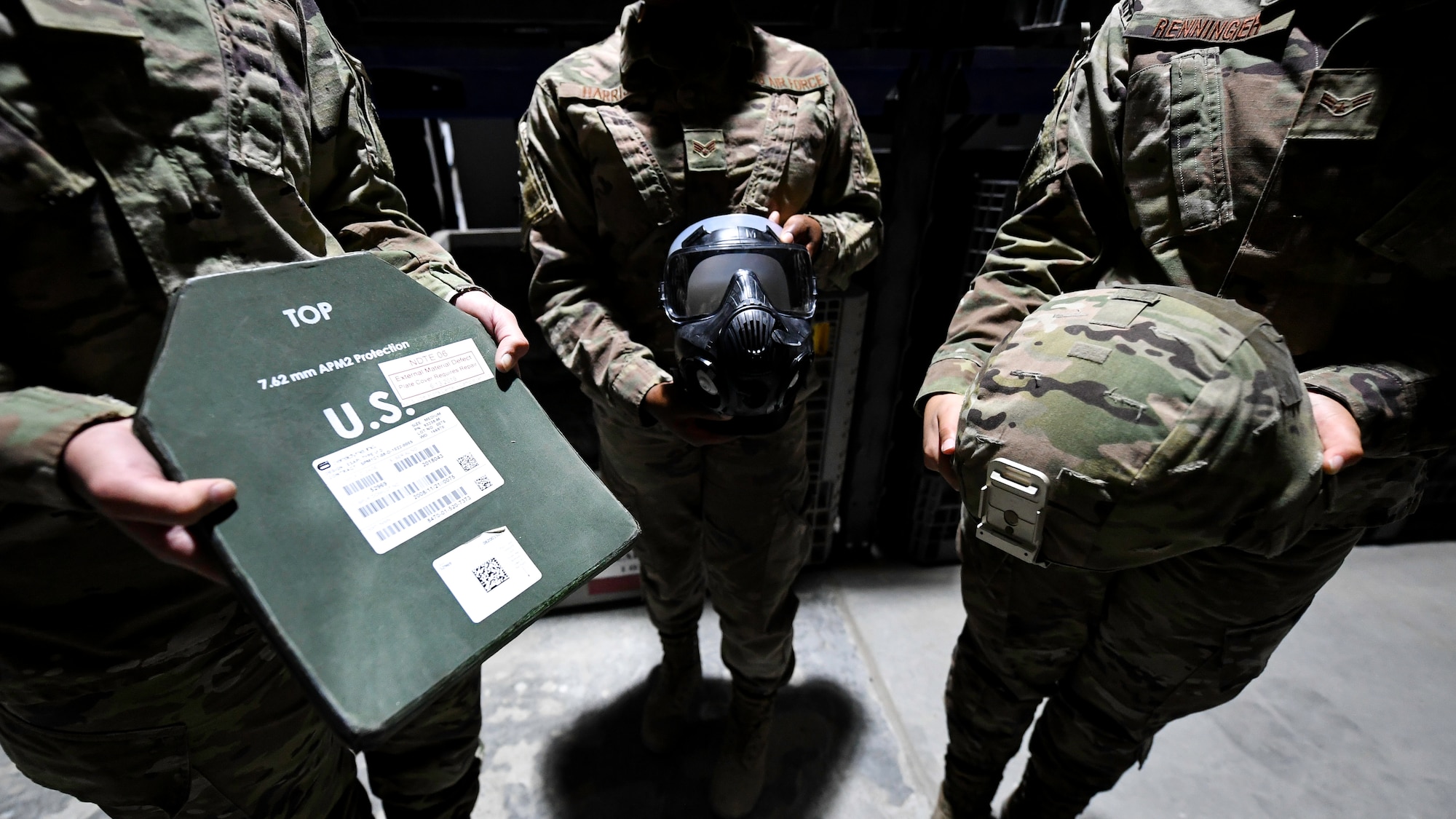Airmen with the 386th Expeditionary Logistics Readiness Squadron expeditionary theater distribution center showcase some of the items stocked in the facility at Ali Al Salem Air Base, Kuwait, Aug. 13, 2019. The theater distribution center packs a variety of items to include body armor, advanced combat helmets, ballistics plates and other chemical warfare defense items. (U.S. Air Force photo by Staff Sgt. Mozer O. Da Cunha)