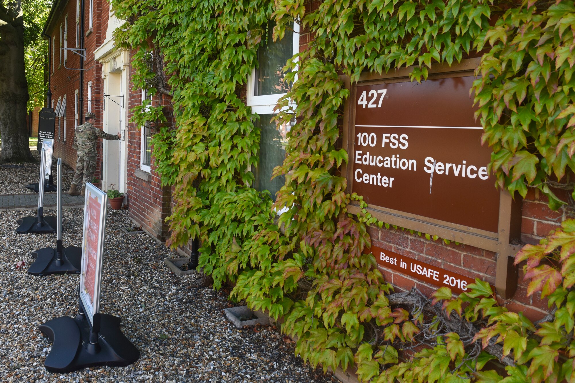 An Airman enters the base education office on RAF Mildenhall, England, Aug. 15, 2019. The education office can offer resources to Airmen who are continuing their service or transitioning from the military into a civilian career. (U.S. Air Force photo by Airman 1st Class Joseph Barron)
