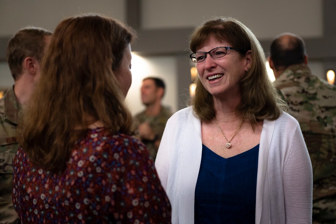 Marge Weber, right, mother of Capt. Mark Weber, speaks with a guest of a dedication ceremony Aug. 16, 2019, at Moody Air Force Base, Ga. The event room in building 400 at Moody was dedicated to and renamed in honor of Capt. Mark Weber, 38th Rescue Squadron combat rescue officer. Weber, a Texas native, was killed in an HH-60G Pave Hawk crash in Anbar Province, Iraq, March 15, 2018, while supporting Operation Inherent Resolve. (U.S. Air Force photo by Airman 1st Class Taryn Butler)