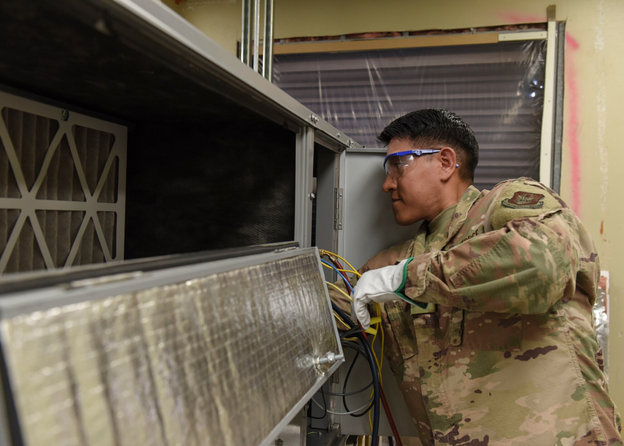Staff Sgt. Andre Chamilco, 366th Training Squadron HVAC/R craftsman course student, ensures a ventilation system is properly functioning at Sheppard Air Force Base, Texas, Aug. 14, 2019. HVAC/R technicians are essential for the functionality of a base. Having proper heating and cooling systems within buildings assists with the welfare of base personnel. (U.S. Air Force photo by Senior Airman Ilyana A. Escalona)
