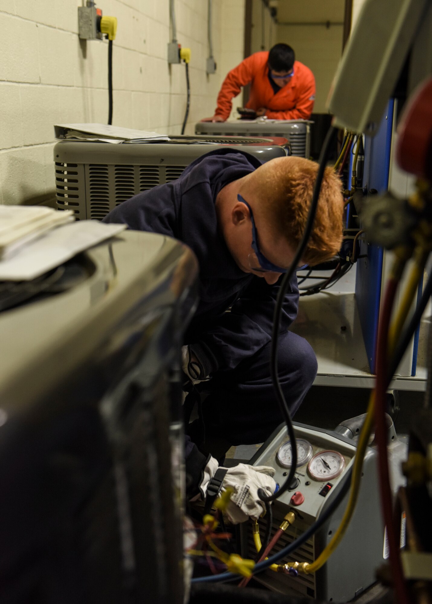 Airman Basic Preston Franklin, 366th Training Squadron HVAC/R technician course student, works with a split system trainer to practice recovering and charging a refrigerant at Sheppard Air Force Base, Texas, Aug. 16, 2019. HVAC/R technicians are essential for the functionality of a base. Having proper heating and cooling systems within buildings assists with the welfare of base personnel. (U.S. Air Force photo by Senior Airman Ilyana A. Escalona)