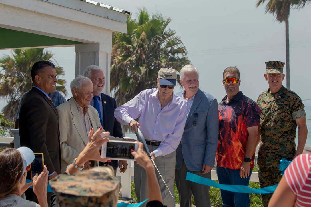 U.S. Marine Brig. Gen. Daniel B. Conley, right, the commanding general of Marine Corps Installations West, Marine Corps Base Camp Pendleton, and with representatives from Marine Corps Community Services and the San Diego Nice Guys charity, cut a ribbon during a dedication ceremony for beach cottages at San Onofre Beach on Marine Corps Base Camp Pendleton, California, Aug. 15, 2019. The ceremony marked the completion of renovations for the last two of 13 cottages to be rebuilt at San Onofre. The updated cottages are designed to be more accessible to wounded service members or those with disabilities. (U.S Marine Corps photo by Lance Cpl. Andrew Cortez)