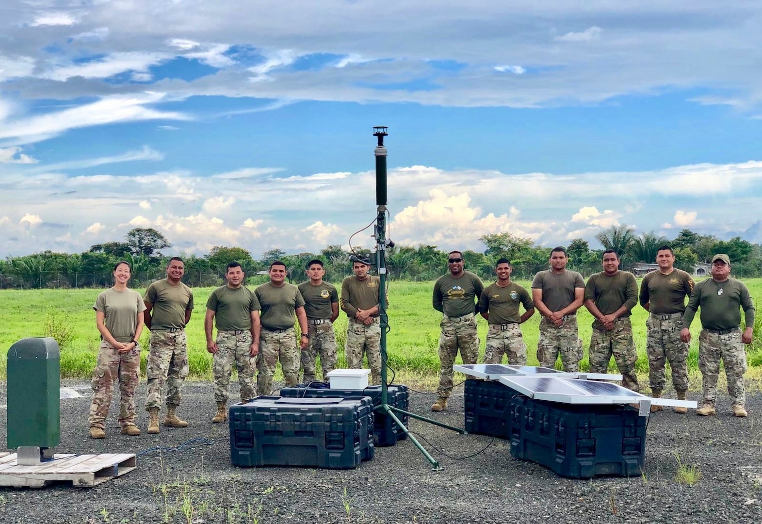 Tech. Sgt. Darlene Byers, 571st Mobility Support Advisory Squadron air advisor for the Radar, Airfield and Weather Systems, left, poses for a group photo with personnel from the National Air and Naval Service, or SENAN, at Nicanor Air Base, Panama. As an instructor, Byers provided critical training on the weather system at the height of Panama’s rainy season. (Courtesy Photo)