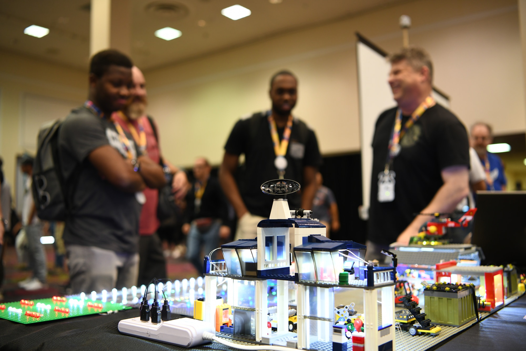 Attendees visit the 90th Cyberspace Operations Squadron “Bricks in the Loop” display during DEF CON 27 Hacking Conference in Las Vegas, Aug. 9, 2019. “Bricks in the Loop” mimics an Air Force installation to simulate real-world cyber systems in training cyber operators. (U.S. Air Force photo by Tech. Sgt. R.J. Biermann)