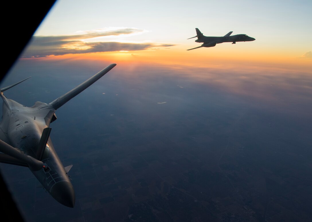 Two U.S. Air Force 7th Bomb Wing B-1B Lancers, perform air refueling training with a 92nd Air Refueling Wing KC-135 Stratotanker at Dyess Air Force Base, Texas, Aug. 13, 2019.
