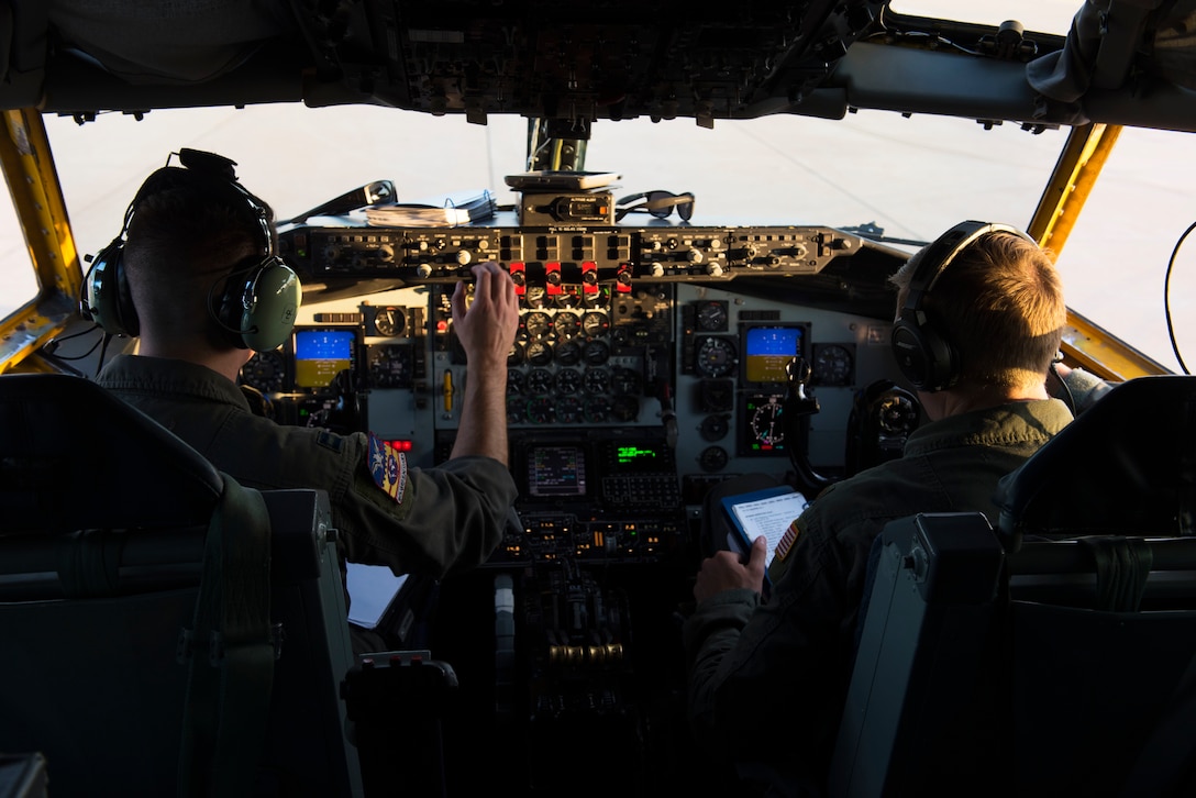 U.S. Air Force Capt. Howard Palmer (left) and Maj. Britton Adamson (right), 384th Air Refueling Squadron pilots, perform pre-flight checks prior to air refueling training with B-1B Lancers assigned to the 7th Bomb Wing at Dyess Air Force Base, Texas, Aug. 14, 2019.