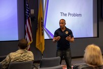 Air Force Master Sgt. Seneca Linder facilitates Air Force Green Dot training at Joint Task Force Civil Support. Green Dot is an Air Force strategy to decrease multiple forms of interpersonal violence simultaneously across the service, from domestic violence and abuse to sexual assault and suicide. It is an annually-required training for all Air Force personnel, both military and civilian. (Official DoD photo by Mass Communication Specialist 3rd Class Michael Redd/RELEASED)