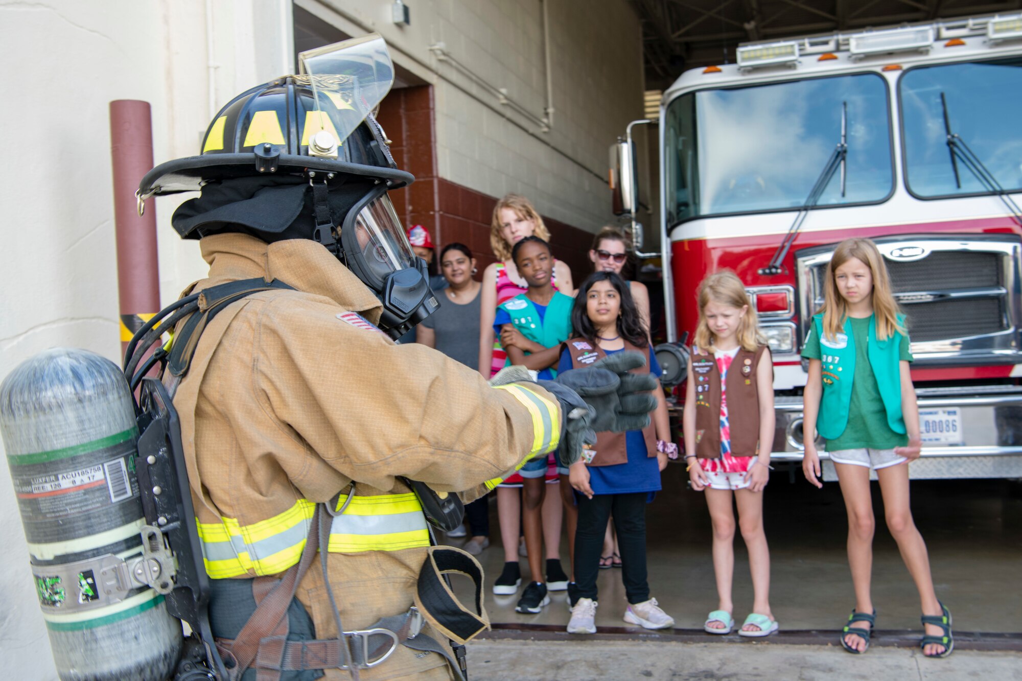 South West Texas Girl Scout Troop 367 toured Joint Base San Antonio-Randolph Aug. 9,  witnessing a military working dog demonstration at the 902nd Security Forces Squadron kennel, visiting the 902nd Civil Engineer Squadron fire department and touring the base’s static aircraft display. (U.S. Air Force photo by Sabrina Fine)