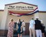 The Kidd family unveil the new name of the Kidd Weapons Load Training facility at Barksdale Air Force Base, Louisiana, in honor of the late Tech. Sgt. Joshua L. Kidd Aug. 16, 2019.