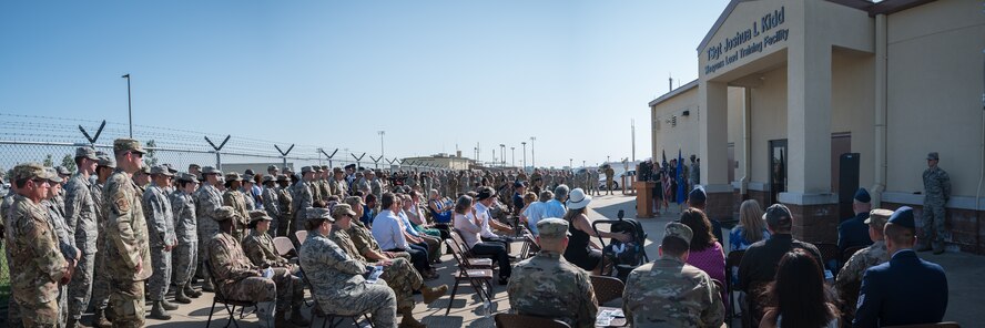 The Kidd family, friends and Airmen of the 2nd Bomb Wing gather for the renaming of the Weapons Load Training facility at Barksdale Air Force Base, Louisiana, to the Kidd Weapons Load Training facility in honor of the late Tech. Sgt. Joshua L. Kidd Aug. 16, 2019.