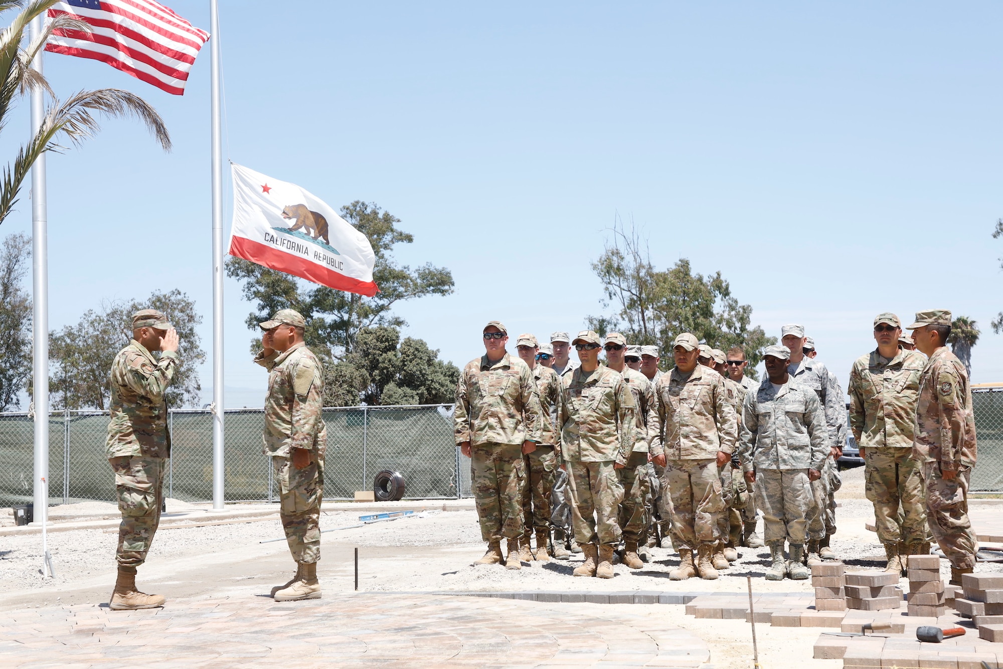 U.S. Air National Guard members from the 146 Civil Engineer Squadron perform a re-enlistment ceremony outside the headquarters building at the Channel Islands Air National Guard Station, August 9, 2019. U.S. Air National Guard photo by Senior Airman Todd Senff.