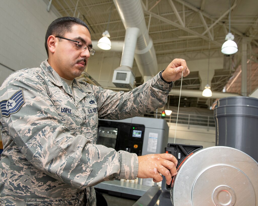 Travis AFB is the first field-unit location in the Air Force to have the Stratays F900 3-D industrial printer certified by the Federal Aviation Administration and Air Force Advanced Technology and Training Center for use on aircraft replacement parts. (U.S. Air Force photo by Louis Briscese)