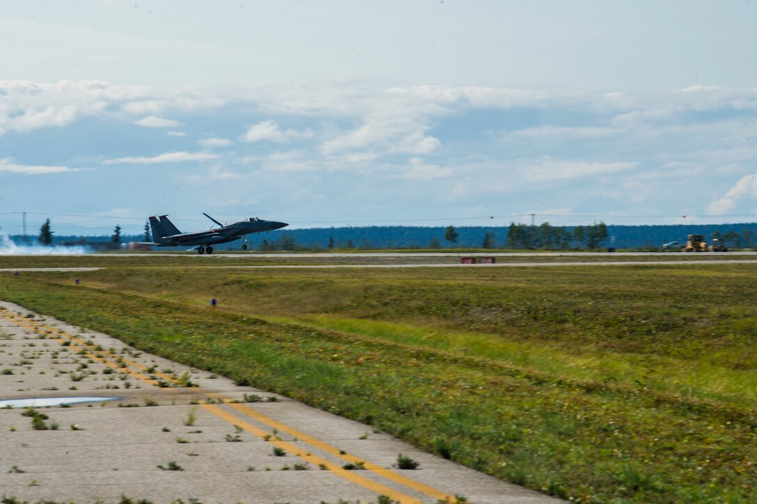 U.S. Airmen assigned to the 67th Aircraft Maintenance Unit, Kadena Air Base, Japan, prepare an F-15 Eagle for takeoff at Allen Army Airfield during Red Flag-Alaska 19-3 at Fort Greely, Alaska, Aug. 8, 2019. During the exercise, Fort Greely was used to implement agile combat employment, which allows aircraft maintainers to perform maintenance operations in remote locations with as few people as possible. (U.S. Air Force photo by Senior Airman Isaac Johnson)