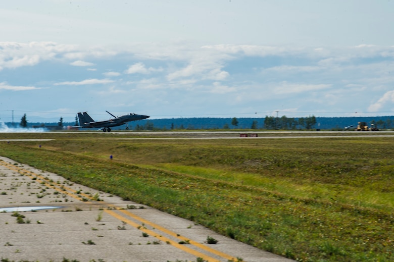 U.S. Airmen assigned to the 67th Aircraft Maintenance Unit, Kadena Air Base, Japan, prepare an F-15 Eagle for takeoff at Allen Army Airfield during Red Flag-Alaska 19-3 at Fort Greely, Alaska, Aug. 8, 2019. During the exercise, Fort Greely was used to implement agile combat employment, which allows aircraft maintainers to perform maintenance operations in remote locations with as few people as possible. (U.S. Air Force photo by Senior Airman Isaac Johnson)