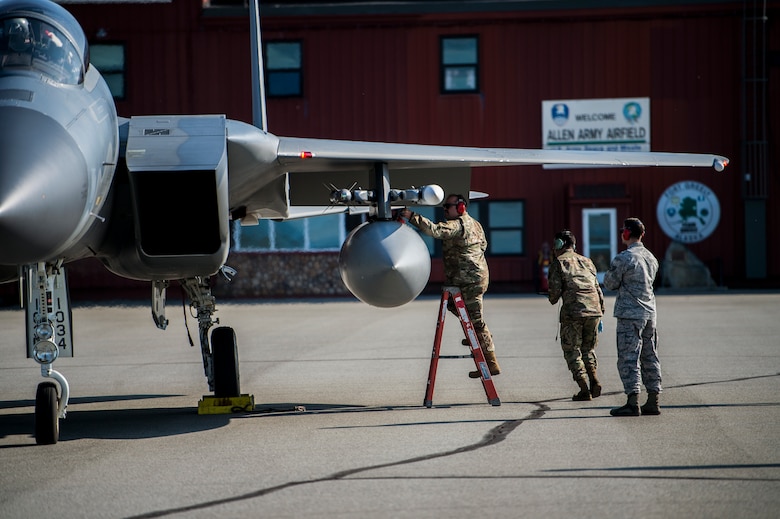 U.S. Airmen assigned to the 67th Aircraft Maintenance Unit, Kadena Air Base, Japan, prepare an F-15 Eagle for takeoff at Allen Army Airfield during Red Flag-Alaska 19-3 at Fort Greely, Alaska, Aug. 8, 2019. During the exercise, Fort Greely was used to implement agile combat employment, which allows aircraft maintainers to perform maintenance operations in remote locations with as few people as possible. (U.S. Air Force photo by Senior Airman Isaac Johnson)