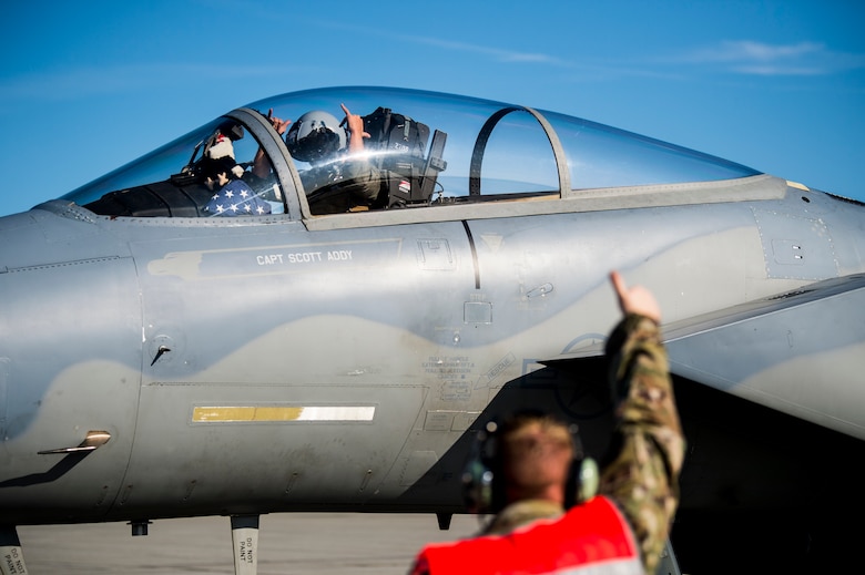 U.S. Airmen assigned to the 67th Aircraft Maintenance Unit, Kadena Air Base, Japan, prepare an F-15 Eagle for takeoff at Allen Army Airfield during Red Flag-Alaska 19-3 at Fort Greely, Alaska, Aug. 8, 2019. During the exercise, Fort Greely was used to implement agile combat employment, which allows aircraft maintainers to perform maintenance operations in remote locations with as few people as possible. (U.S. Air Force photo by Senior Airman Isaac Johnson)