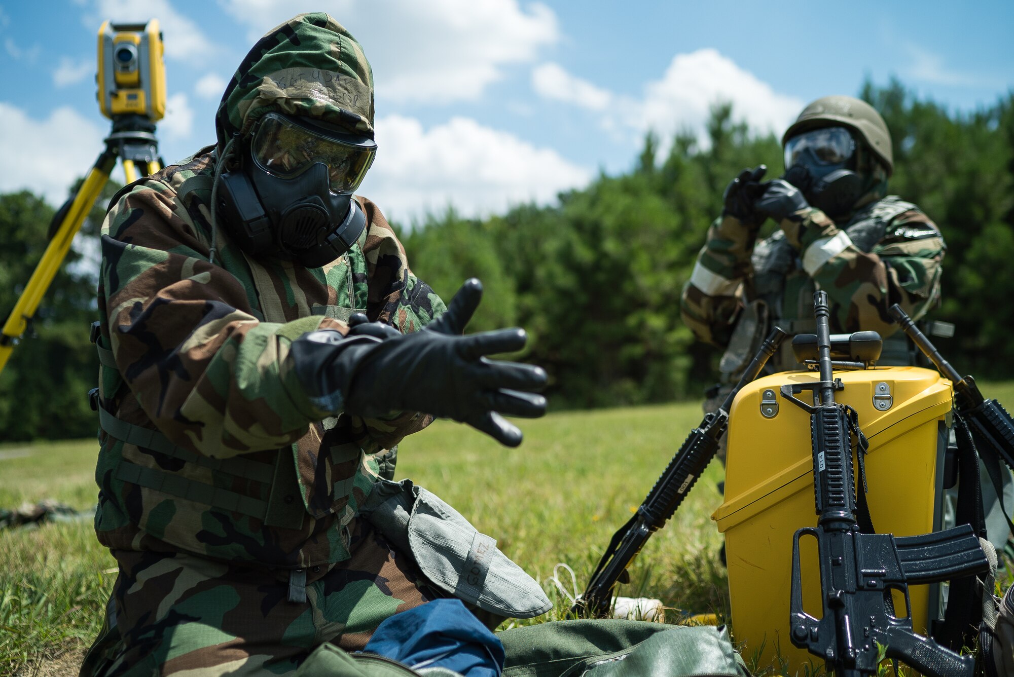 U.S. Air Force Senior Airman Emma Grove, left, and Senior Airman Soloman Ivy, 908th Civil Engineer Squadron engineering assistants, put on mission-oriented protective posture gear during exercise Patriot Warrior 2019 at Dobbins Air Reserve Base, Georgia, Aug. 10, 2019. Patriot Warrior is Air Force Reserve Command’s premier exercise, providing an opportunity for Airmen to train with joint and international partners in airlift, aeromedical evacuation and mobility support. (U.S. Air Force photo by Tech. Sgt. Richard Mekkri)