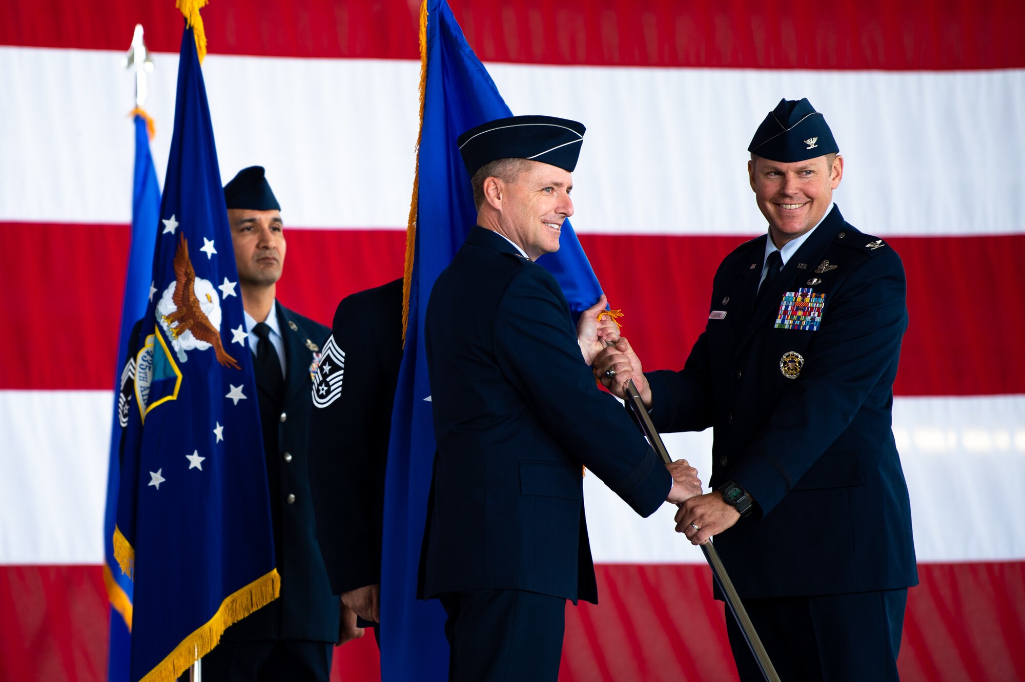 U.S. Air Force Col. Daniel C. Clayton, right, assumes command of the 435th Air Ground Operations Wing and 435th Air Expeditionary Wing, from Maj. Gen. John M. Wood, Third Air Force commander, at Ramstein Air Base, Germany, Aug. 16, 2019. The two wings provide battlefield and expeditionary Airmen to combatant commanders, and are capable of responding to humanitarian and contingency operations throughout the world. (U.S. Air Force photo by Staff Sgt. Devin Boyer)