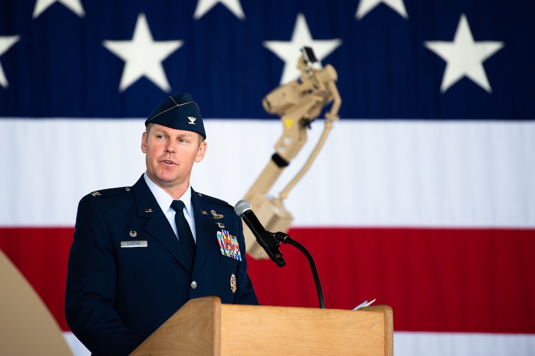 U.S. Air Force Col. Daniel C. Clayton, 435th Air Ground Operations Wing and 435th Air Expeditionary Wing commander, gives a speech during an assumption of command ceremony at Ramstein Air Base, Germany, Aug. 16, 2019. The two wings provide battlefield and expeditionary Airmen to combatant commanders, and are capable of responding to humanitarian and contingency operations throughout the world. (U.S. Air Force photo by Staff Sgt. Devin Boyer)