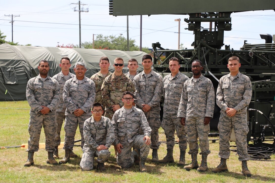 Members of the 752nd Operations Support Squadron assemble their Tactical Operations Center for Exercise Excellent Fury in Savannah, GA, July 2019. Excellent Fury, hosted by the 134th Air Control Squadron, invited these twelve Airmen to participate. Back row from left: Amn. First Class Holmes, Staff Sgt. Pearson, Master Sgt. Chou, Staff Sgt. Dyckman, Maj. Hagardt, Amn. First Class Davis, Amn. Montemayor, Amn. First Class Anderson, Mooney and Rawat.  Front row: Amn. First Class Wang and Nielsen. (U.S. Air Force courtesy photo).