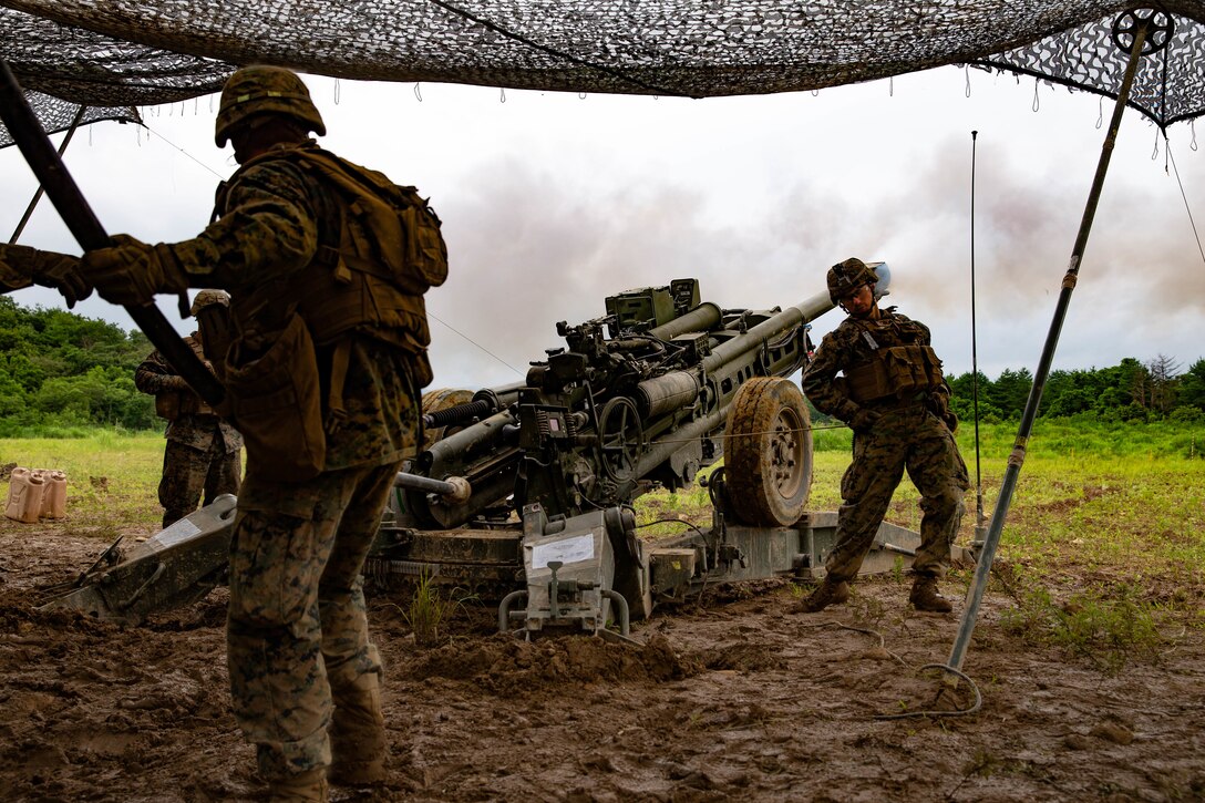 U.S. Marines with 3rd Battalion, 12th Marine Regiment, 3rd Marine Division, fire a M777 Howitzer during The Artillery Relocation Training Program in Ojojihara, Japan, July 25, 2019. ARTP provides 12th Marine Regiment with essential, live-fire training outside Okinawa to increase combat readiness and support the Treaty of Mutual Cooperation and Security. (U.S. Marine Corps photo by Lance Cpl. Christine Phelps)