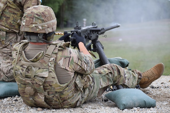 Sgt. Wesley Cyrus, 2500th Digital Liaison Detachment chemical noncommissioned officer, fires the .50-caliber weapon system during a familiarization and qualification range Aug. 15 at Grafenwoehr Training Area in Germany. The 2500th DLD is conducting basic warrior tasks and familiarizing themselves with battlefield enablers during annual training.