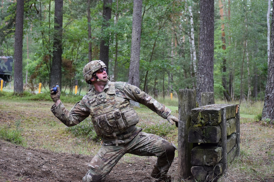 Capt. Michael E. Benjamin, 2500th DLD operations officer, throws a practice hand grenade during a familiarization and qualification range Aug. 16 at Grafenwoehr Training Area in Germany.