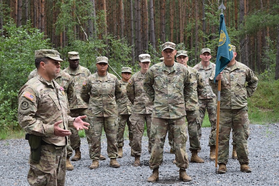 The outgoing commander of the 2500th Digital Liaison Detachment, Col. Christopher Varhola, thanks his Soldiers after receiving a meritorious service medal during a ceremony Aug. 17 at Camp Normandy, Grafenwoehr, Germany. Varhola will retire this November after almost 30 years of service in the U.S. Army.