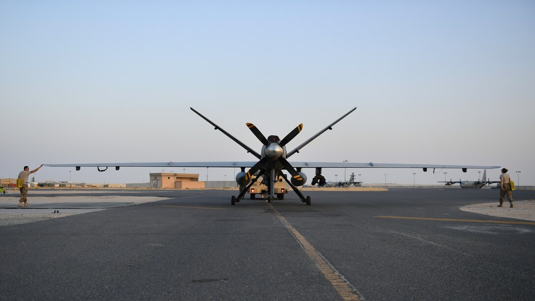 Maintainers from the 386th Expeditionary Aircraft Maintenance Squadron tow an MQ-9 Reaper unmanned aerial vehicle into position for an engine test before Intelligence, Surveillance and Reconnaissance (ISR) operations at Ali Al Salem Air Base, Kuwait, July 23, 2019. Reaper’s are maintained, launched and recovered from deployed locations arounf the world but are remotely operated from bases with the United States. (U.S. Air Force Photo by Staff Sgt. Mozer O. Da Cunha)